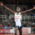 Rhonex Kipruto of Kenya reacts after crossing the finish line 