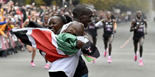 Eliud Kipchoge celebrates with his wife Grace Sugut