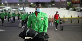 Harambee Stars midfielder Anthony Akumu at Jomo Kenyatta International Airport.