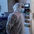 Paramedics assess a Covid-19 patient in Lenasia, Johannesburg on January 4, 2021.