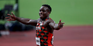 Kenya's Ferdinand Omurwa celebrates his third place in the men's 100m heats