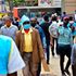 Nairobi residents walk along Tom Mboya Street