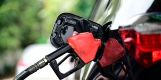 Fueling a car.