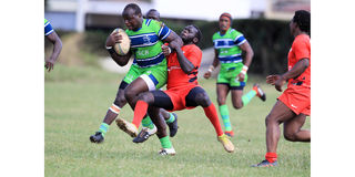 Bob Muhati (left) of KCB vies with Tony Odhiambo of Impala