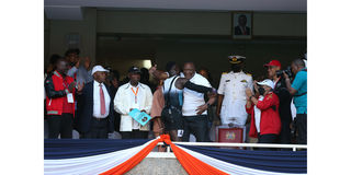 President Uhuru Kenyatta congratulates Ferdinand Omanyala