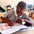 Pupils sitting a KCPE mathematics paper. 