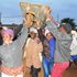 Residents of Kimunye market in Kirinyaga celebrate