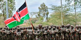 KDF soldiers attend a flag presentation ceremony before their deployment to the DRC