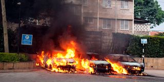 Vehicles in flames at the scene of the terror attack at Dusit D2 Hotel on January 15, 2019.
