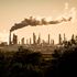 Smoke cloud rises from an oil petroleum refinery