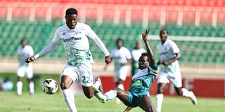 Gor Mahia striker Benson Omalla (left) vies with KCB midfielder Apollo Otieno
