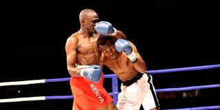Kenya's Rayton Okwiri (left) fights against Tanzania's Shabani Ndaro