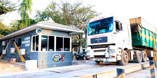 Trucks pass through the Mtwapa Weighbridge Station in Kilifi County