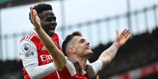Arsenal midfielder Granit Xhaka (right) celebrates with team mate Bukayo Saka