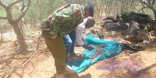 Police officers at the scene where five people were gunned down by bandits in an attack at Lami Nyeusi, West Pokot