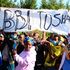 Youth display a placard to show support for BBI