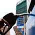 An attendant at a Nyeri petrol station prepares to fill up a car in August 2020.