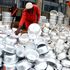 Byron Muga sells sufurias in Gikomba market in Nairobi.