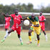 Mathare United forward Timothy Otieno (right) vies for the ball with SS Assad defender Juma Mwajao