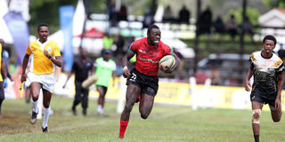 Kenya Shujaa's Patrick Odongo charges for the try line