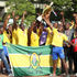 National Cereals and Produce Board players and officials celebrate with the trophy