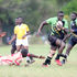 Kabras Sugar's George Nyambua (right) goes past Nondescript's Ian Omoke (down) 