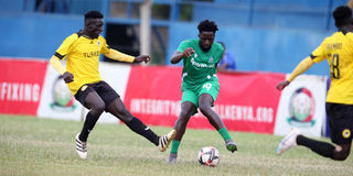 Gor Mahia midfielder Austin Odhiambo (right) vies with Tusker midfielder David Odoyo