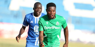 Gor Mahia forward Benson Omalla (right) controls the ball under pressure Nairobi City Stars defender Rowland Makati