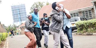 Edith Wanjiku (left) at the City Mortuary in Nairobi after viewing the body of her son