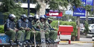 Anti-Riot police officers seated at the Hilton Square along Moi Avenue